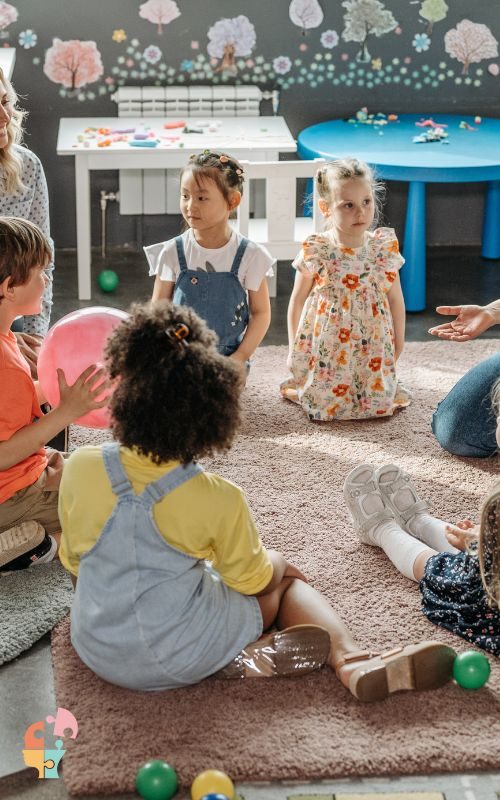 Children sitting on carpet at school to learn